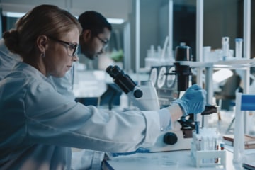 forensic investigators in laboratory