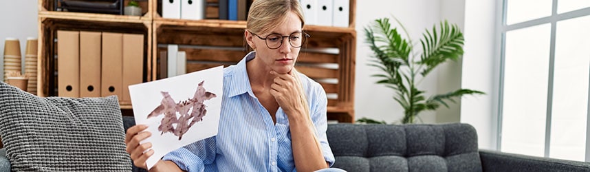psychologist shows inkblot test to virtual client